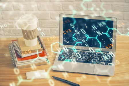 Desktop computer background and formula hologram writing. Double exposure. Education concept.の写真素材