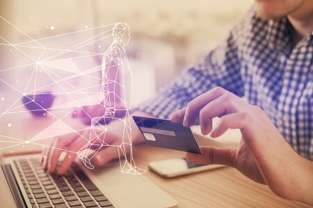 Double exposure of man hands holding a credit card and creative drawing. Start up and E-commerce pay...