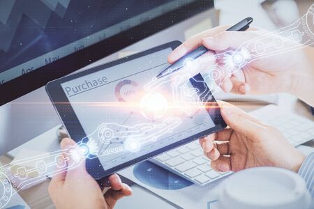 Multi exposure of mans hands holding and using a digital device and data theme drawing. Innovation concept.の写真素材