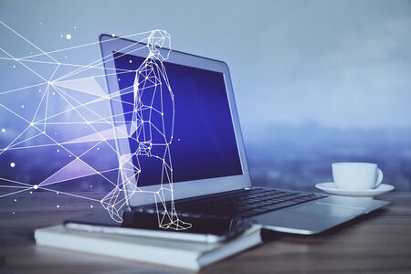 Desktop computer background in office and start up theme hologram drawing. Double exposure. Startup concept.の写真素材