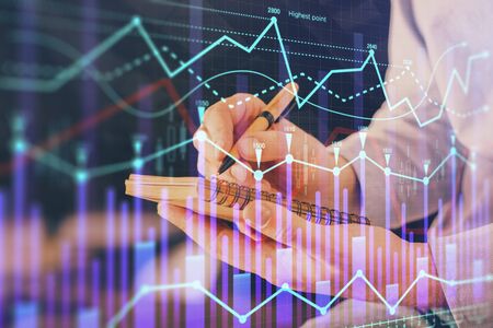 Double exposure hands with stock market chart. Concept of research and analysis.