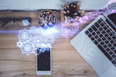 Double exposure of technology theme drawing over work table desktop. Top view. Global data analysis concept.の写真素材