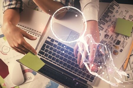 Double exposure of man and woman working together and creative hologram drawing. Computer...