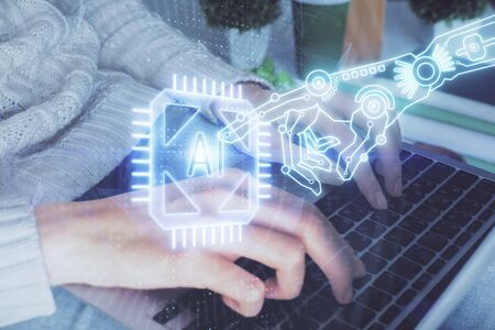 Double exposure of woman hands working on computer and data theme hologram drawing. Tech concept.の写真素材