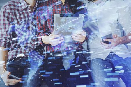 Double exposure of data theme hologram drawing and man and woman working together holding and using...