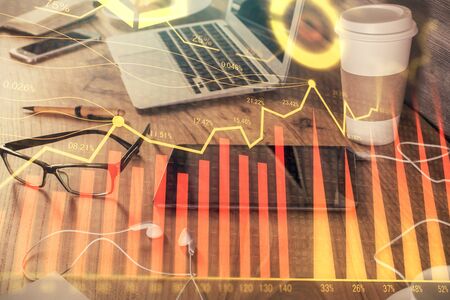 Double exposure of financial graph drawing and cell phone background. Concept of forex tradingの写真素材