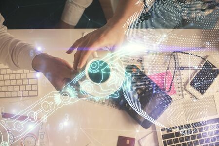 Double exposure of man and woman working together and technology theme drawing. Computer background. Top View. High tech concept.の写真素材