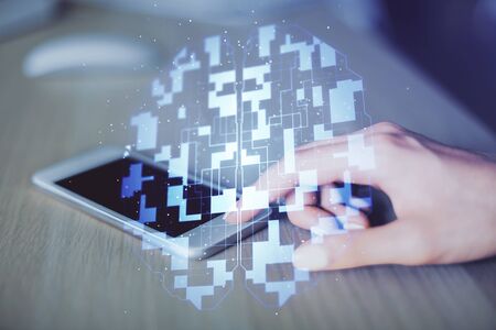 Double exposure of technology sketch hologram and woman holding and using a mobile device.の写真素材