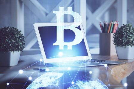 Multi exposure of blockchain and crypto economy theme hologram and table with computer background....