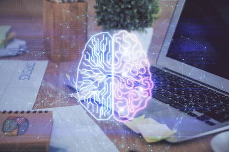 Double exposure of table with computer and brain hologram. Data innovation concept.の写真素材