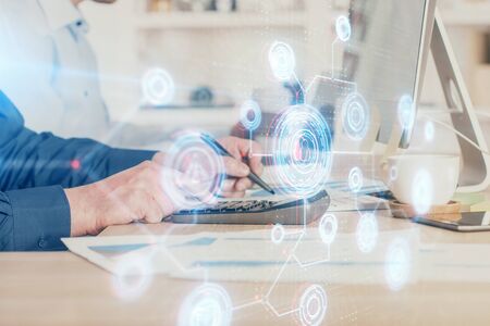 Double exposure of data internet theme hologram with man working on computer on background. Concept of innovation.の写真素材