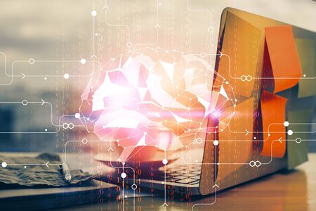 Multi exposure of work space with computer and human brain hologram. Brainstorm concept.