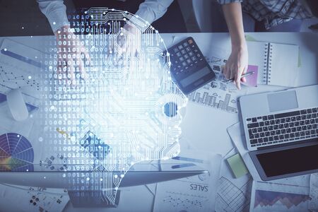 Double exposure of man and woman working together and human brain hologram drawing. Brainstorm concept. Computer background. Top View.の写真素材