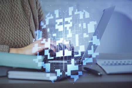 Double exposure of woman hands working on computer and data theme hologram drawing. Tech concept.の写真素材