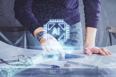 Double exposure of mans hand holding and using a digital device and data theme drawing. Technology...