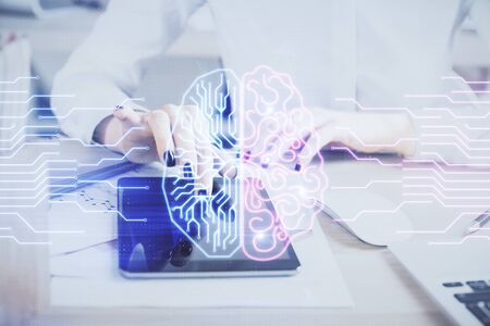 Double exposure of brain sketch hologram and woman holding and using a mobile device.の写真素材