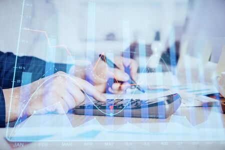 Financial trading graph multi exposure with man desktop background. Concept of success.