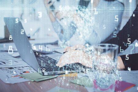 Double exposure of woman hands working on computer and data theme hologram drawing. Tech concept.