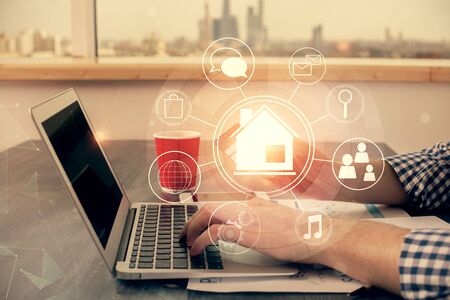 Double exposure of man hands holding a credit card and city drawing. modern town and E-commerce pay on-line concept.の写真素材