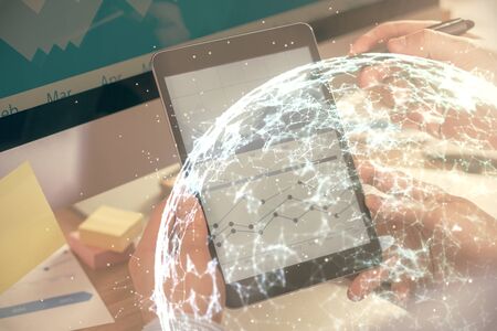 Double exposure of mans hands holding and using a phone and social network theme drawing.