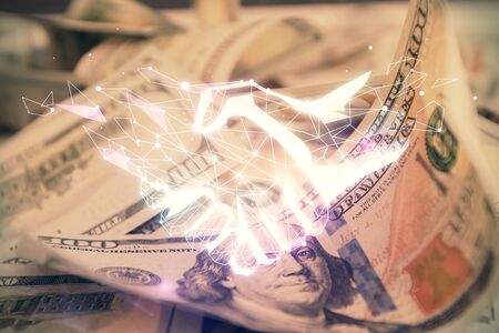 Double exposure of handshake drawing over usa dollars bill background. Partnership concept.の写真素材