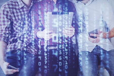 Double exposure of data theme hologram drawing and man and woman working together holding and using a mobile device.の写真素材