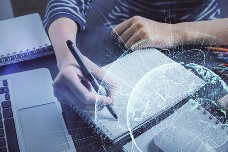 Social network theme hologram over womans hands writing background. Concept of international people...