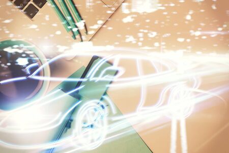 Auto pilot hologram drawing over computer on the desktop background. Top view. Double exposure. Tech concept.の写真素材