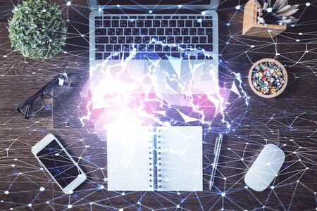 Double exposure of brain drawing hologram over topview work table background with computer. Concept...