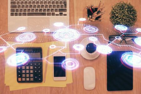 Double exposure of social network theme drawing over table with phone. Top view. People connecting concept.の写真素材
