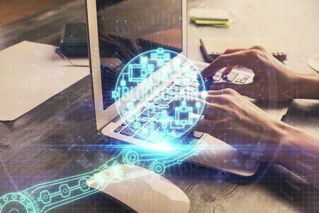 Double exposure of woman hands typing on computer and crypto market theme hologram drawing....