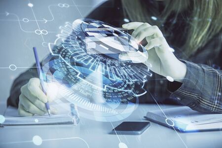 Double exposure of woman on-line shopping holding a credit card and data theme hologram drawing. E-commerce concept.の写真素材
