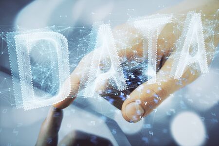 Multi exposure of mans hand holding and using a digital device and data theme drawing. Innovation concept.の写真素材