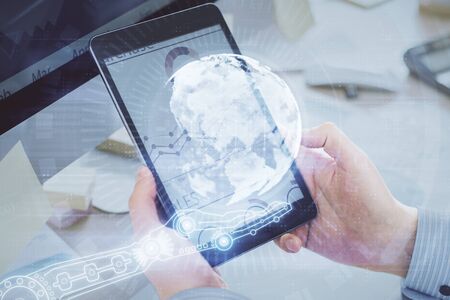 Multi exposure of mans hands holding and using a digital device and map drawing. International business concept.の写真素材
