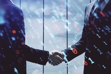 Double exposure of data theme hologram and handshake of two men. Partnership in IT industry concept.の写真素材