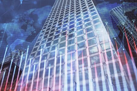Forex chart on cityscape with tall buildings background multi exposure. Financial research concept.の写真素材
