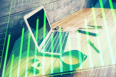 Multi exposure of forex graph and work space with computer. Concept of international online trading.の写真素材