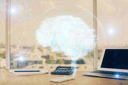 Multi exposure of work space with computer and human brain hologram. Brainstorm concept.