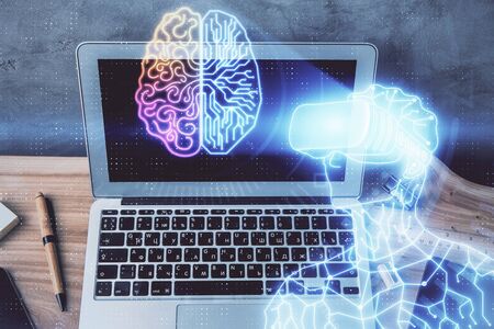 Computer on desktop with AR theme icon. Multi exposure. Concept of augmented reality.の写真素材
