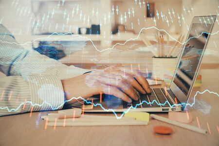 Double exposure of stock market graph with man working on laptop on background. Concept of financial analysis.の写真素材