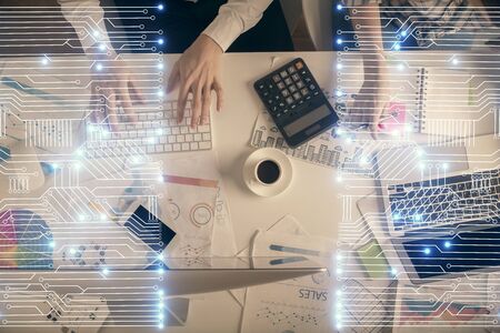 Double exposure of man and woman working together and technology theme drawing. Computer background. Top View. High tech concept.の写真素材
