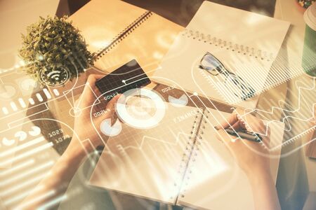 Multi exposure of woman on-line shopping holding a credit card and tech theme drawing. Technology concept.の写真素材