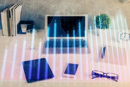 Stock market graph and table with computer background. Multi exposure. Concept of financial analysis.の写真素材