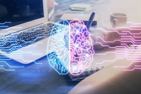 Multi exposure of writing hand on background with brain hologram. Concept of learning.