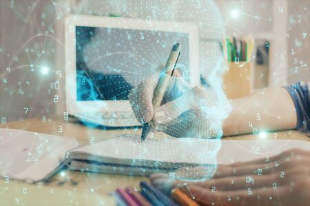 Multi exposure of writing hand on background with brain hologram. Concept of self learning.の写真素材