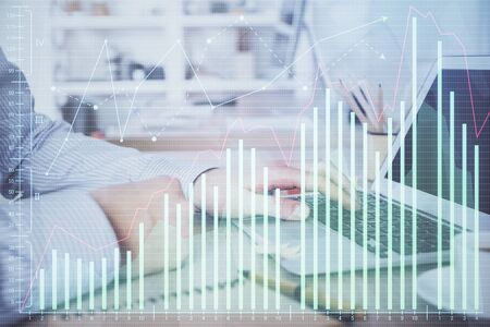Multi exposure of stock market chart with man working on computer on background. Concept of financial analysis.の写真素材
