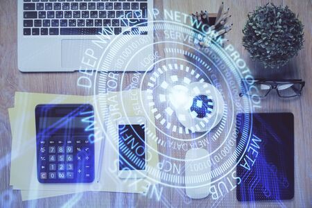 Double exposure of technology theme drawing over work table desktop. Top view. Global data analysis concept.の写真素材
