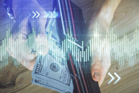 Multi exposure of forex graph drawing hologram and USA dollars bills and man hands. Technical Analysis concept.の写真素材