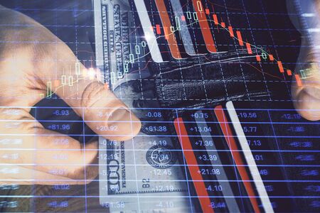 Multi exposure of forex graph drawing hologram and USA dollars bills and man hands. Technical...