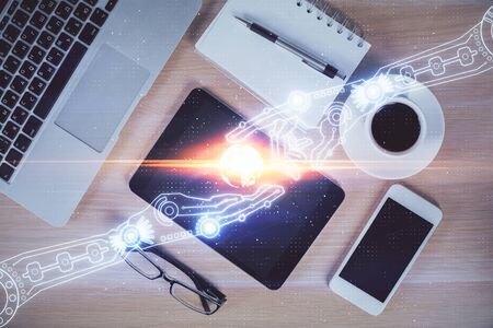 Double exposure of technology theme drawing over work table desktop. Top view. Global data analysis concept.の写真素材